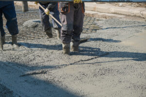 Builders Poured Concrete At The Construction Site